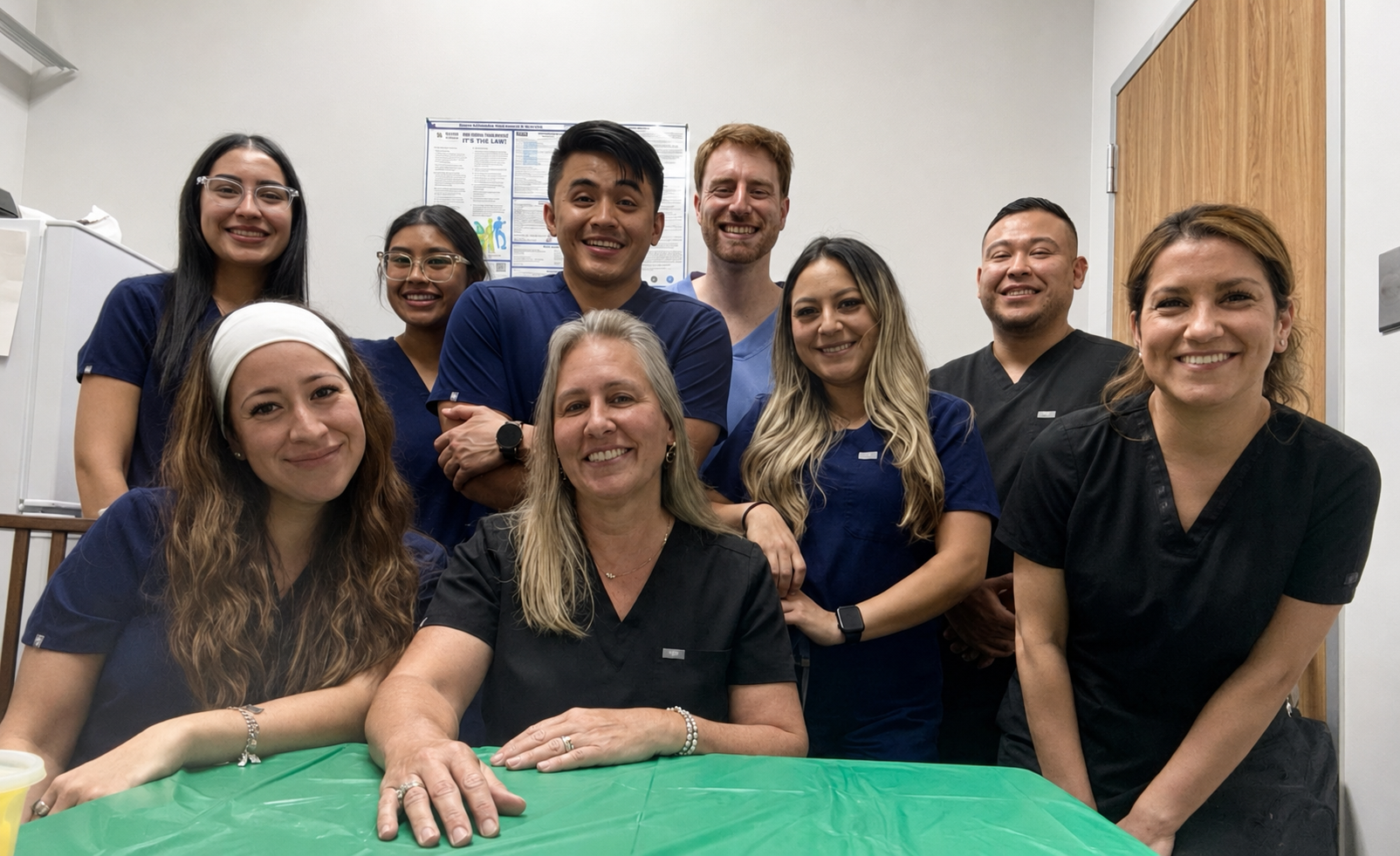 Aroma Dental clinical team gathered together in the office