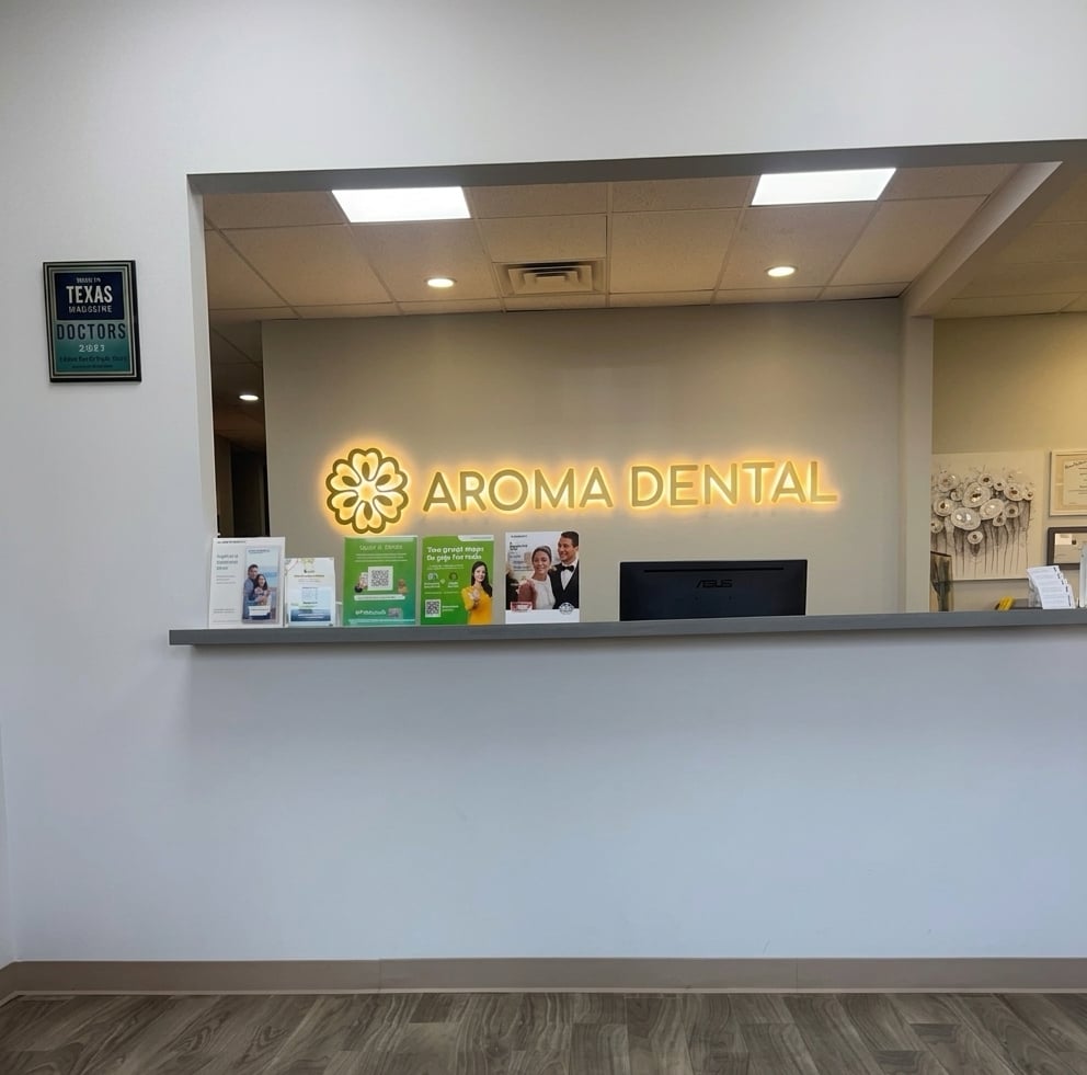 Aroma Dental reception desk and branded signage
