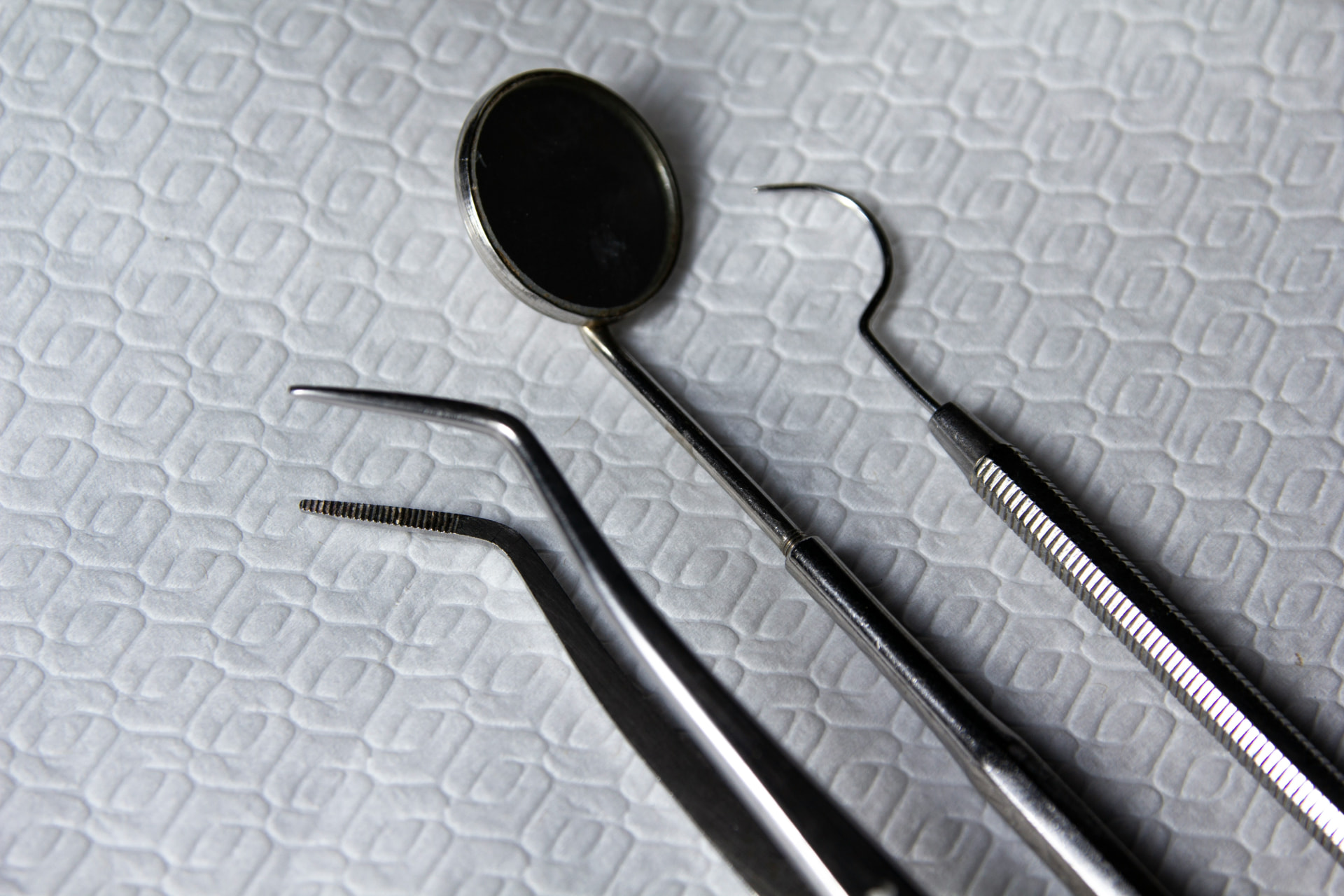 Root Canal Treatment at Aroma Dental in Humble, TX: a dentist performing comfortable root canal treatment on a numbed patient