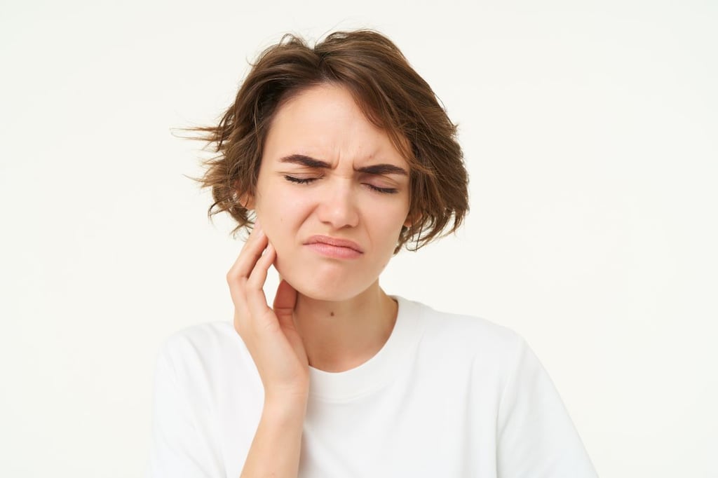 Woman with facial swelling and jaw pain needing an emergency extraction