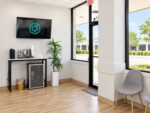 Aroma Dental waiting area with coffee station and seating